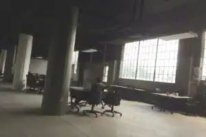 Industrial-style flex unit showing adaptable office workspace potential