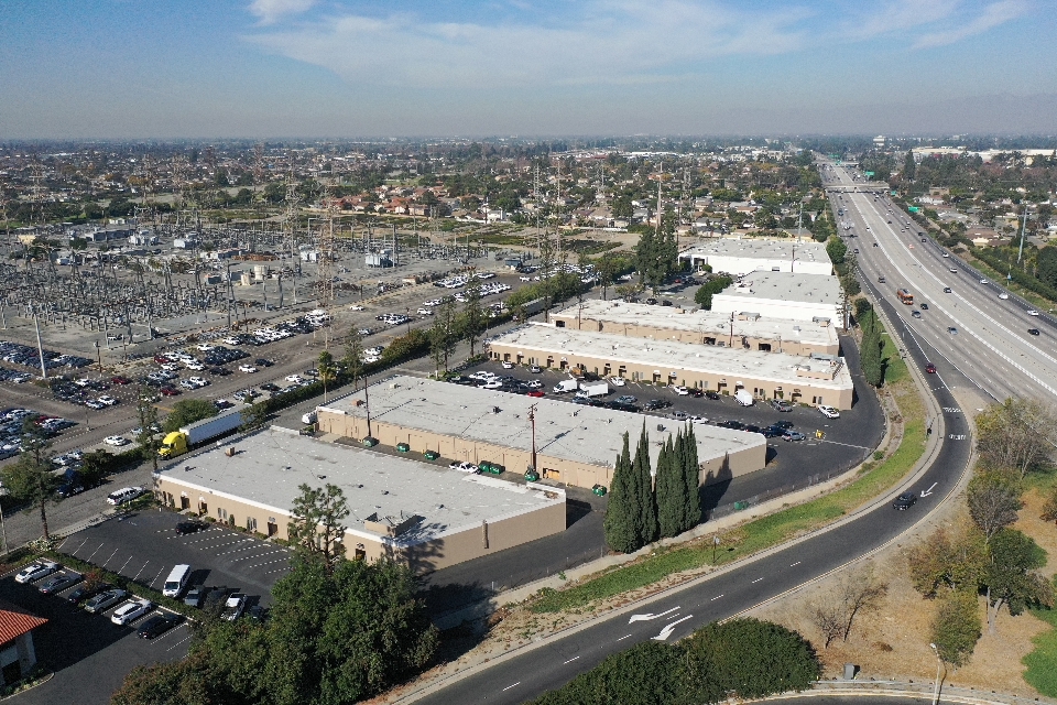 Aerial view of State Road Flex commercial property in Cerritos CA marketed by KEYZ Commercial featuring multiple flex buildings with freeway access