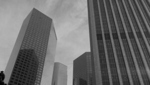 Black and white view of modern downtown Commercial office buildings viewed from street level