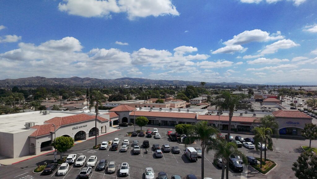 Aerial view of Santa Fe Springs Marketplace retail center in Santa Fe Springs CA by KEYZ Commercial with storefronts, parking, and surrounding neighborhood