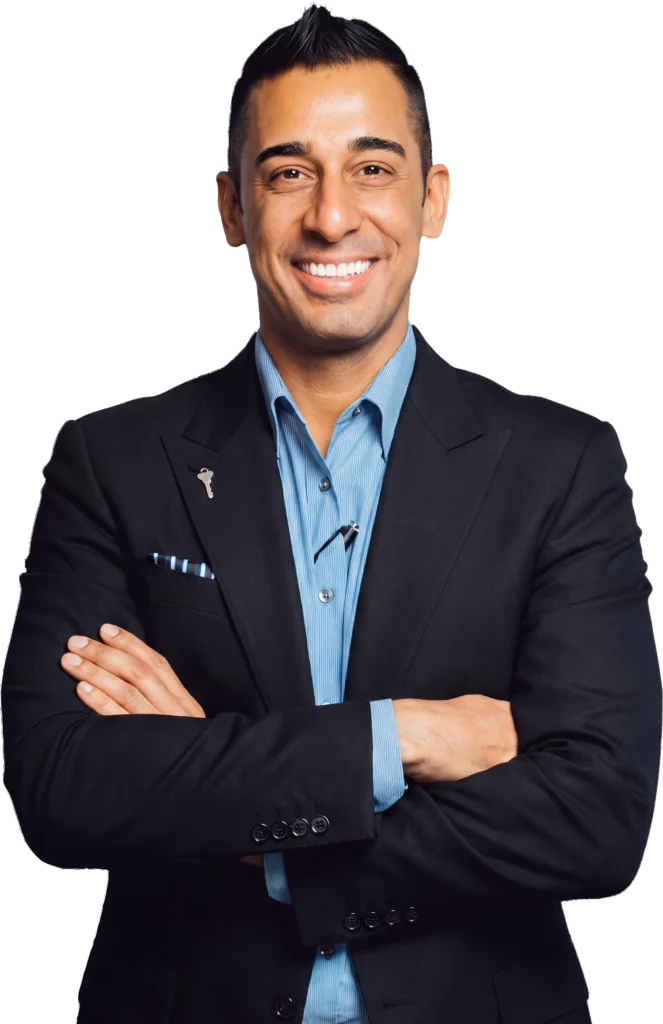 Jason Keyz, Founder and Principal Broker of KEYZ Commercial, arms crossed in a dark blazer and blue striped shirt
